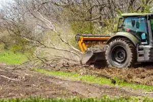 Meeks Land Management tractor forestry mulching brush and trees near Fort Payne, AL
